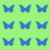 Blaue Schmetterlinge auf grünem Hintergrund